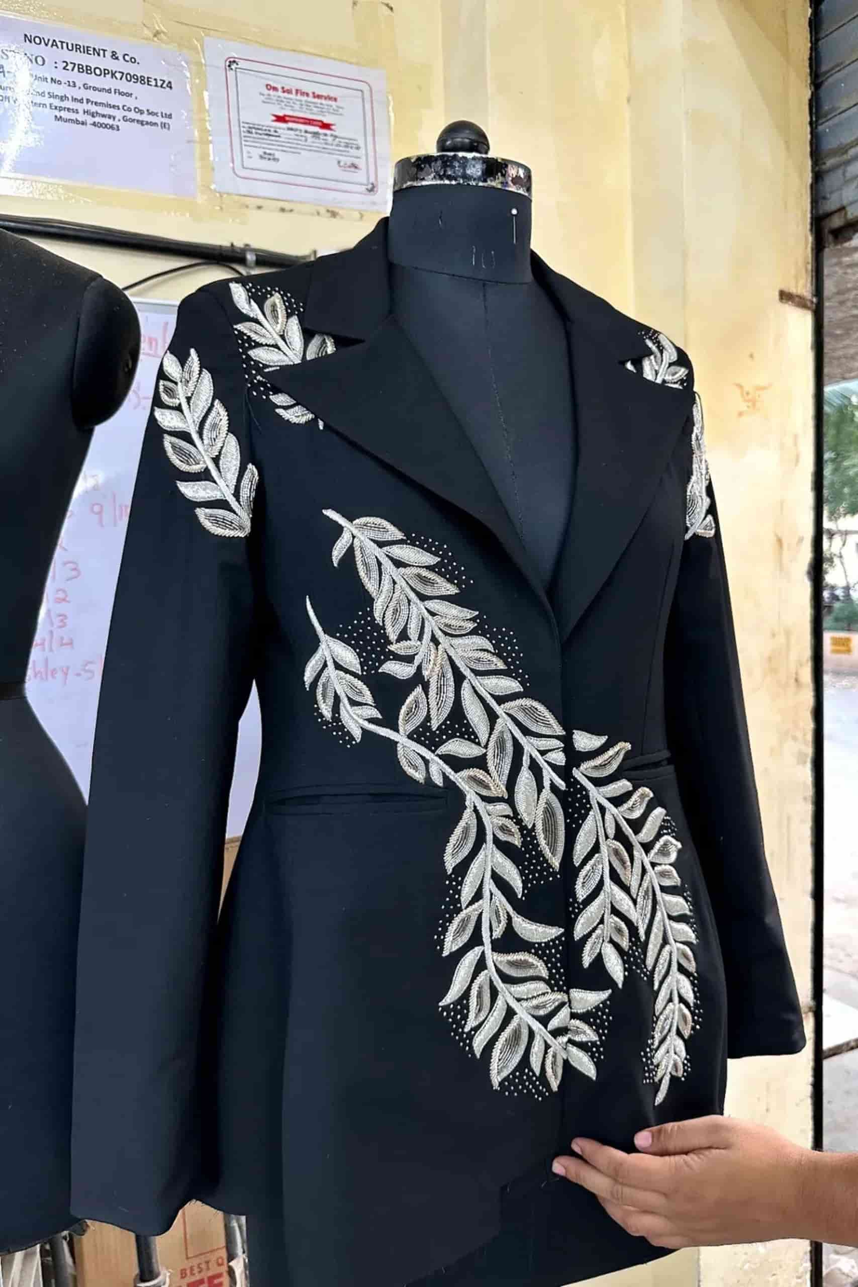 Black tailored blazer with white embroidered leaf detailing