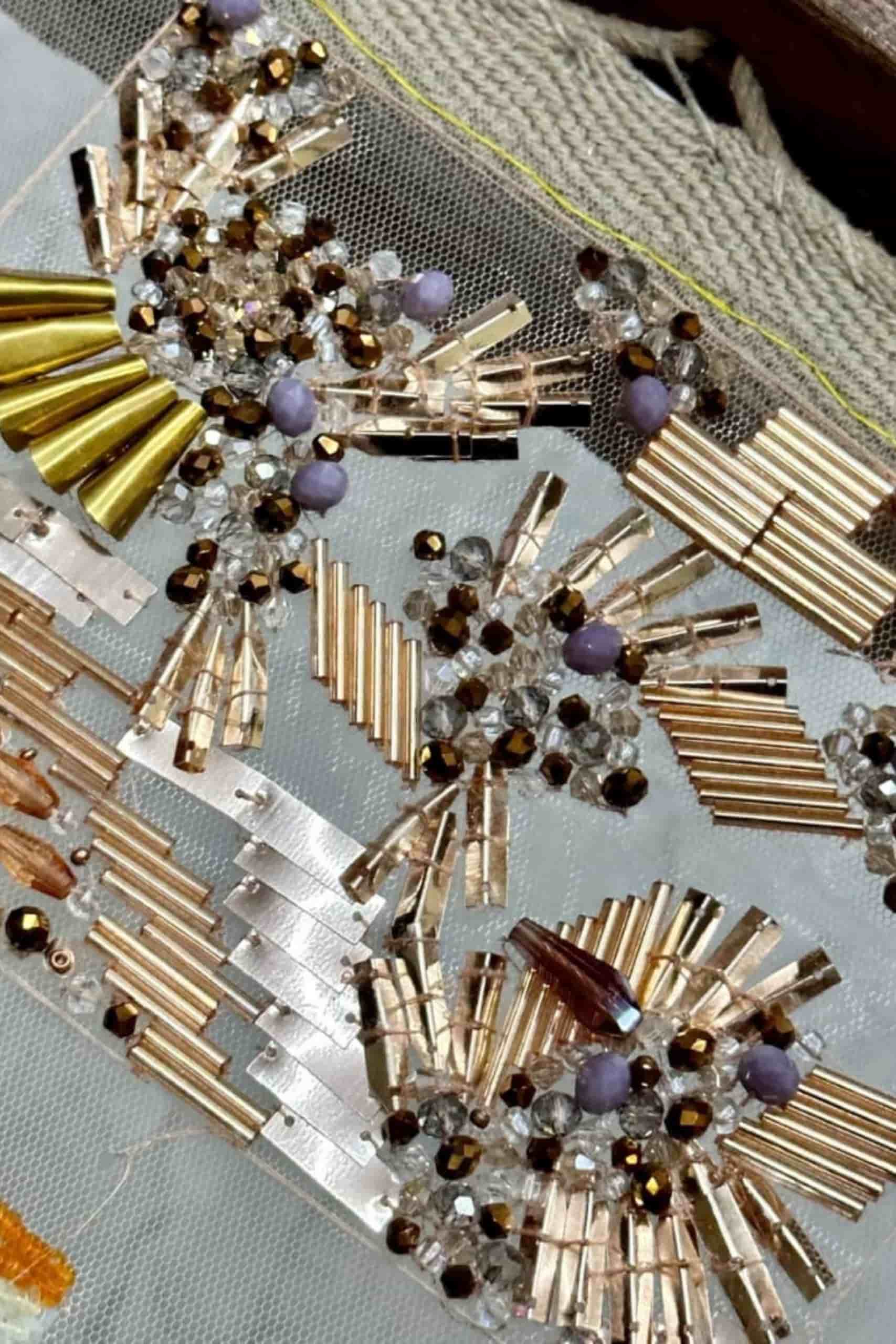 gold embellishments, beads, crystals, and metallic detailing
